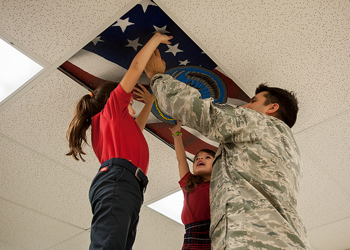 Daughters help create cieling art to depict 123rd Special Tactics Squadron mission