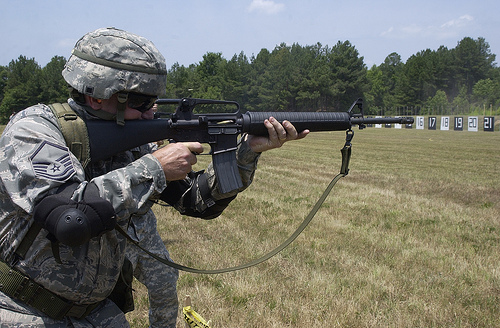 Master Sgt. Darryl Loafman is firing the rifle